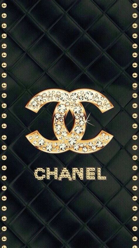 gold chanel sign with black background|Chanel logo wallpaper.